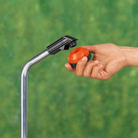 A hand attaching a Gardena hose connector to a metal pipe., miniatuur 5