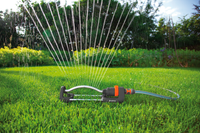 A Gardena oscillating sprinkler watering a lush green lawn in a garden setting., miniatuur 5