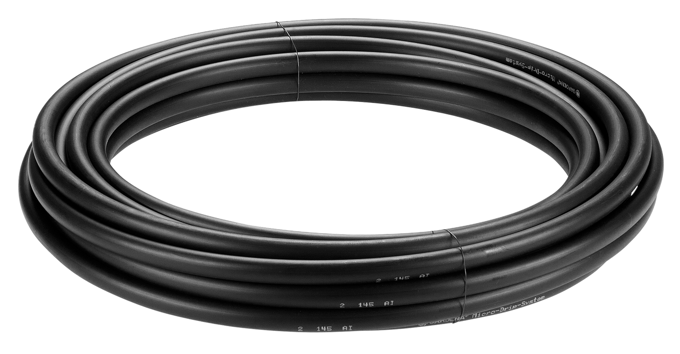 Coiled garden hose suitable for irrigation purposes.