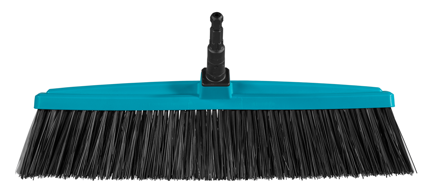 Front view of a broom head with bristles and a connector for a handle.
