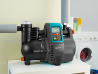 Gardena automatic water pump displayed indoors next to a washing machine., miniatuur 4